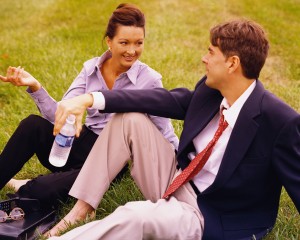 Business People Relaxing on Grass